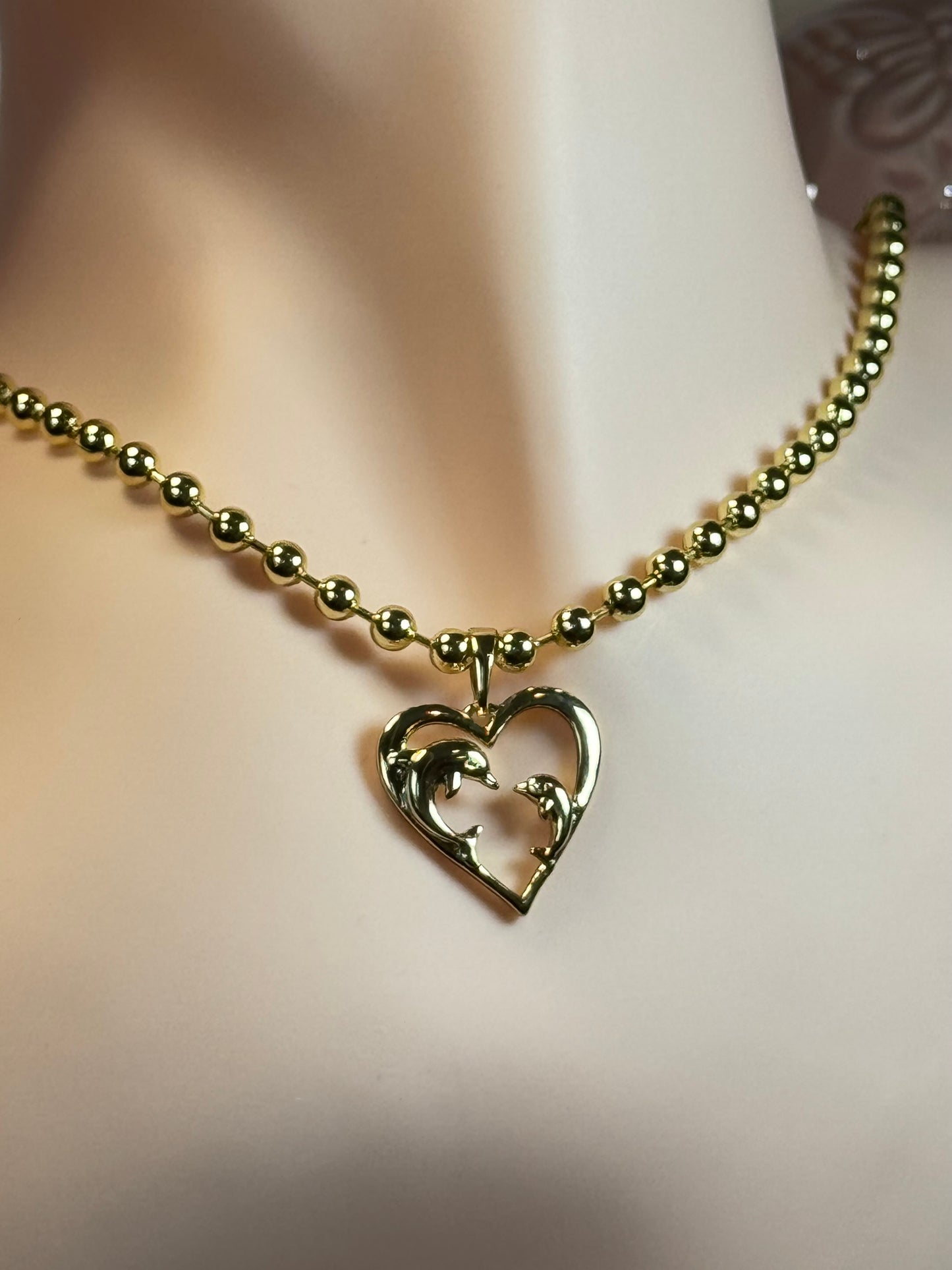 Necklace with dolphin charm in heart