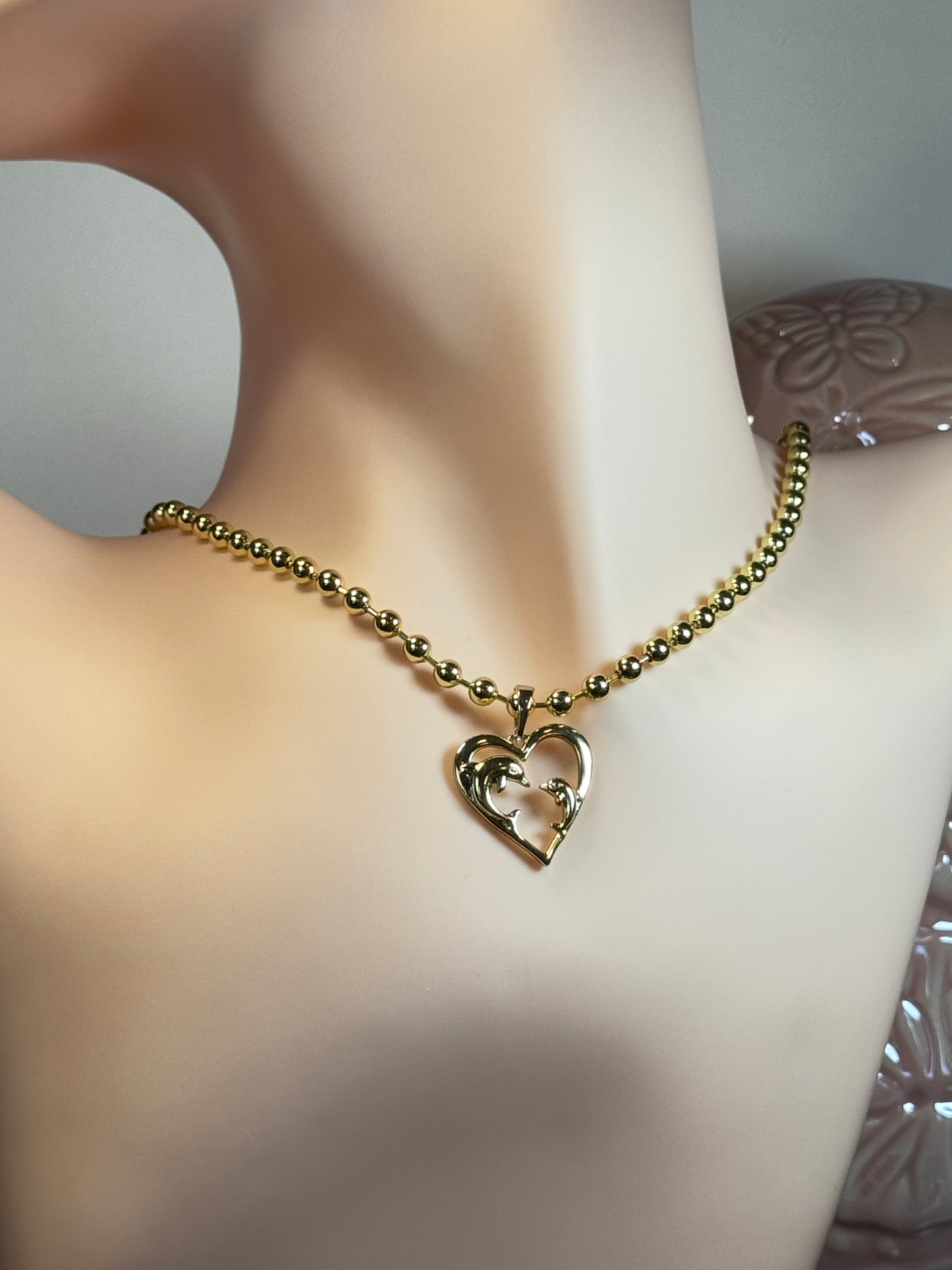 Necklace with dolphin charm in heart